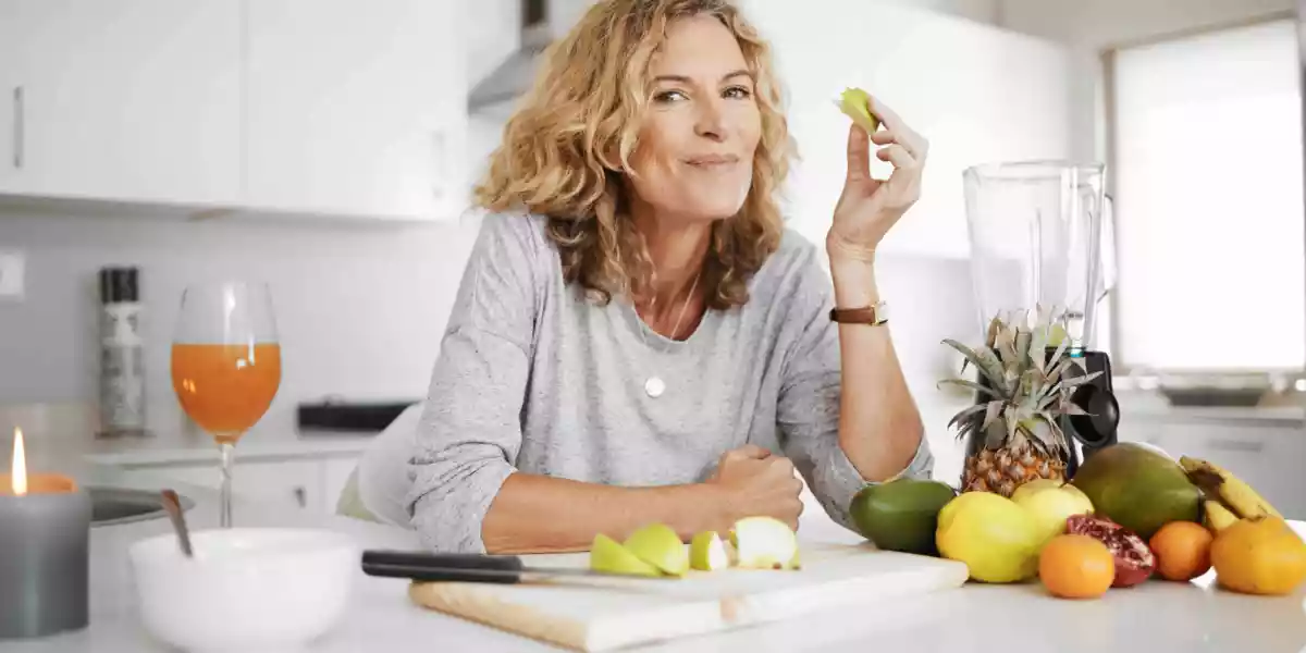 Woman eating fruits and vegetables for a healthier life